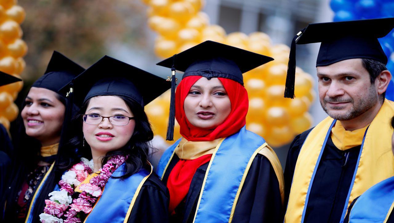 Several students at graduation.